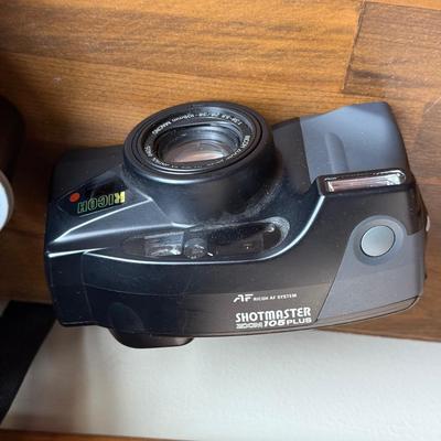 LOT 198X: Ricoh Shot Master Zoom 105 Camera, Nikon National Geographic Society Binoculars, Canon Camera Bag, Unused 35mm Film & More