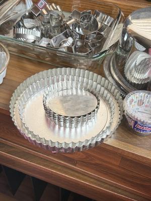 LOT 233: Baking Collection: Mini Cast Iron Loaf Pans in Box, Pie & Tart Pans, Pyrex Glass Dishes, Cake Plate w/ Metal Cloche & More