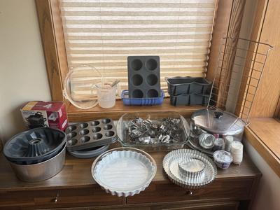LOT 233: Baking Collection: Mini Cast Iron Loaf Pans in Box, Pie & Tart Pans, Pyrex Glass Dishes, Cake Plate w/ Metal Cloche & More