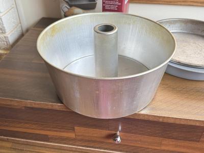 LOT 233: Baking Collection: Mini Cast Iron Loaf Pans in Box, Pie & Tart Pans, Pyrex Glass Dishes, Cake Plate w/ Metal Cloche & More