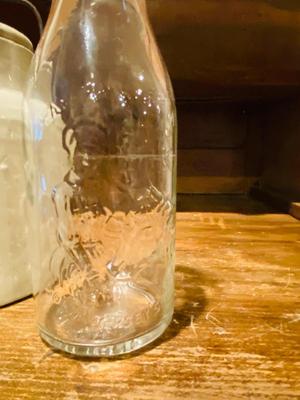 ANTIQUE MILK BOTTLE AND GLAZED STONEWARE JAR WITH LOCKING LID