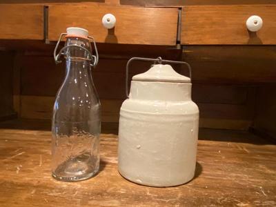 ANTIQUE MILK BOTTLE AND GLAZED STONEWARE JAR WITH LOCKING LID