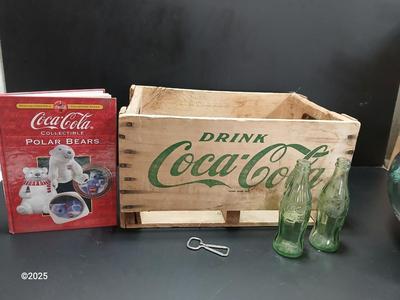 Vintage 1976 wooden Coca Cola crate with coca cola bottles, antique opener and a collectable book