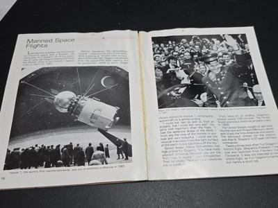 Commitment to Excellence poster and The day We Walked On The Moon paperback book