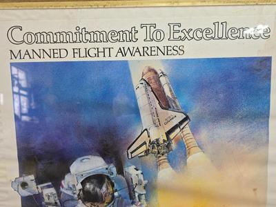 Commitment to Excellence poster and The day We Walked On The Moon paperback book