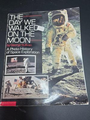 Commitment to Excellence poster and The day We Walked On The Moon paperback book