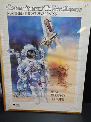 Commitment to Excellence poster and The day We Walked On The Moon paperback book