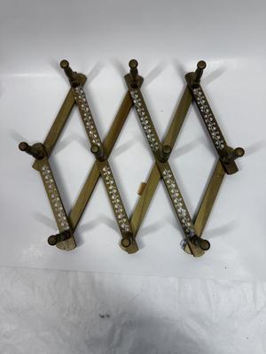 Vintage Wood Accordion Peg Rack, painted gold with white flower accent