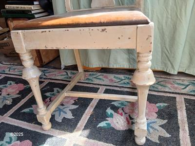 Antique highback diningroom chair with a brass colored swing arm floor lamp