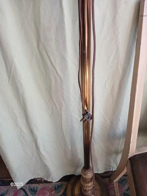 Antique highback diningroom chair with a brass colored swing arm floor lamp