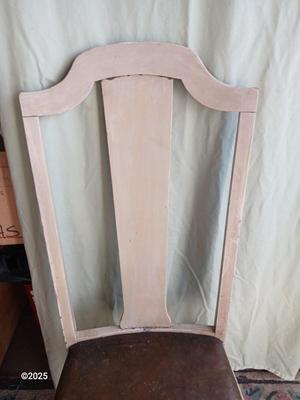 Antique highback diningroom chair with a brass colored swing arm floor lamp