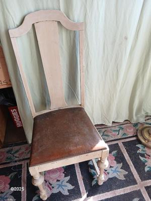 Antique highback diningroom chair with a brass colored swing arm floor lamp