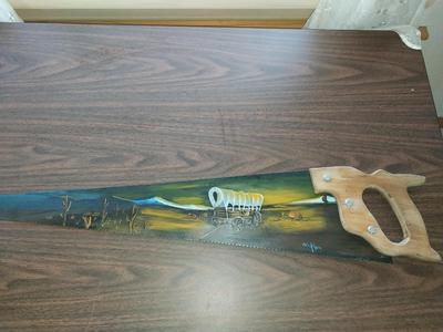 TWO HAND PAINTED SAWS SIGNED BY WICKHAM