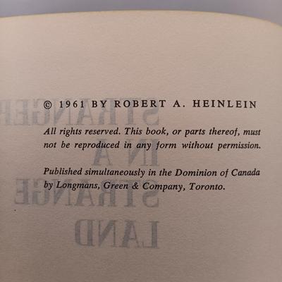 LOT 20: Ray Bradbury's 1953 Fahrenheit 451, Heinlein's 1961 Stranger in a Strange Land, Pratchett's 1981 Strata & More