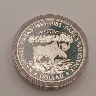 LOT 221: Royal Canadian Mint 1985 Silver Dollar, 1919 Canadian Quarter & 1963 and 1967 UK Pennies