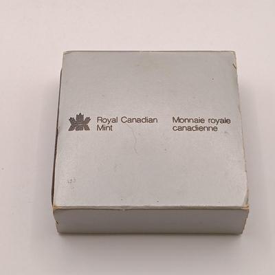 LOT 221: Royal Canadian Mint 1985 Silver Dollar, 1919 Canadian Quarter & 1963 and 1967 UK Pennies