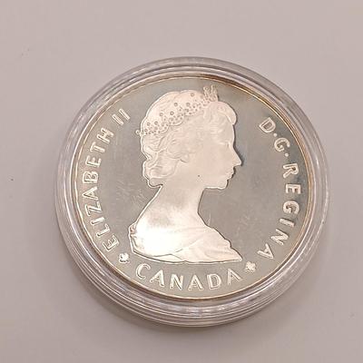 LOT 221: Royal Canadian Mint 1985 Silver Dollar, 1919 Canadian Quarter & 1963 and 1967 UK Pennies