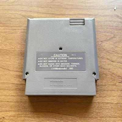LOT 104F: 1985 Nintendo Entertainment System NES Game Cartridges w/ Nintendo Branded Sleeves: Super Mario Bros. 3 & Dr. Mario