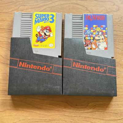 LOT 104F: 1985 Nintendo Entertainment System NES Game Cartridges w/ Nintendo Branded Sleeves: Super Mario Bros. 3 & Dr. Mario