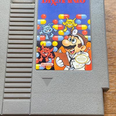 LOT 104F: 1985 Nintendo Entertainment System NES Game Cartridges w/ Nintendo Branded Sleeves: Super Mario Bros. 3 & Dr. Mario