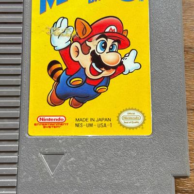 LOT 104F: 1985 Nintendo Entertainment System NES Game Cartridges w/ Nintendo Branded Sleeves: Super Mario Bros. 3 & Dr. Mario