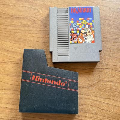 LOT 104F: 1985 Nintendo Entertainment System NES Game Cartridges w/ Nintendo Branded Sleeves: Super Mario Bros. 3 & Dr. Mario