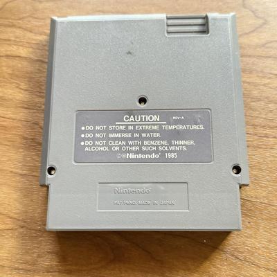 LOT 104F: 1985 Nintendo Entertainment System NES Game Cartridges w/ Nintendo Branded Sleeves: Super Mario Bros. 3 & Dr. Mario