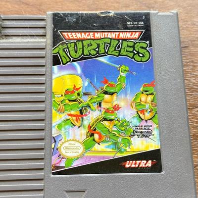 LOT 108F: 1980s-90s NES Game Cartridges: Wheel of Fortune, Millipede, Teenage Mutant Ninja Turtles, Kickle Cubicle, Disney's The...
