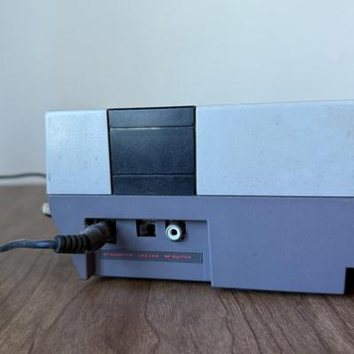 LOT 114F: Nintendo NES Control Deck Model NES-001 w/ 3 Model NES-004 Controllers & Nintendo 64 Control Deck NVS-001