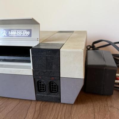 LOT 114F: Nintendo NES Control Deck Model NES-001 w/ 3 Model NES-004 Controllers & Nintendo 64 Control Deck NVS-001
