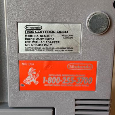 LOT 114F: Nintendo NES Control Deck Model NES-001 w/ 3 Model NES-004 Controllers & Nintendo 64 Control Deck NVS-001