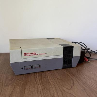 LOT 114F: Nintendo NES Control Deck Model NES-001 w/ 3 Model NES-004 Controllers & Nintendo 64 Control Deck NVS-001