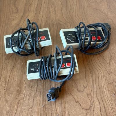 LOT 114F: Nintendo NES Control Deck Model NES-001 w/ 3 Model NES-004 Controllers & Nintendo 64 Control Deck NVS-001