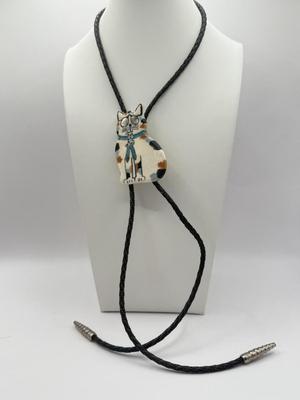 LOT 190J: Two Painted Clay Cat Bolo Ties