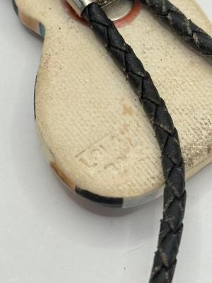 LOT 190J: Two Painted Clay Cat Bolo Ties