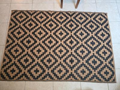 Black and brown reversible outdoor area rug 69" x 47"