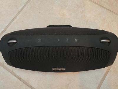 Nice W-KING Bluetooth Speaker with accessories and charging cord.