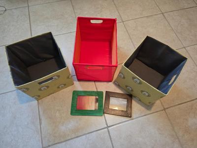 Three canvas like storage baskets and two picture frames