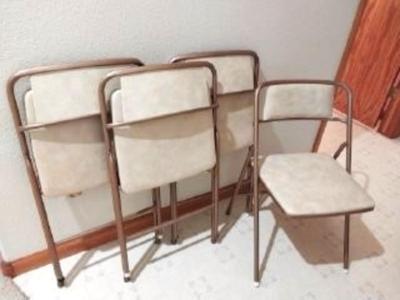 FOUR MATCHING FOLDING CHAIRS