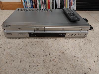 SONY DVD COMBO PLAYER WITH REMOTE AND DVDS