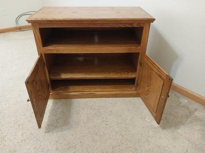 WOODEN STORAGE CABINET ON CASTORS