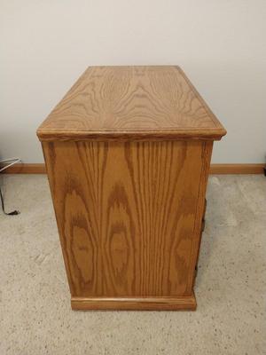 WOODEN STORAGE CABINET ON CASTORS