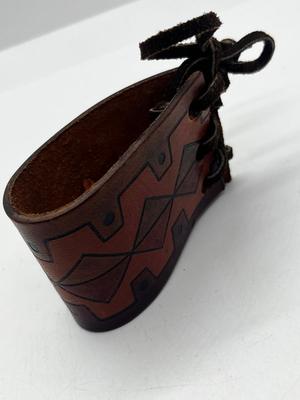 LOT 102: Finger Cymbals and Unique Leather Bracelet