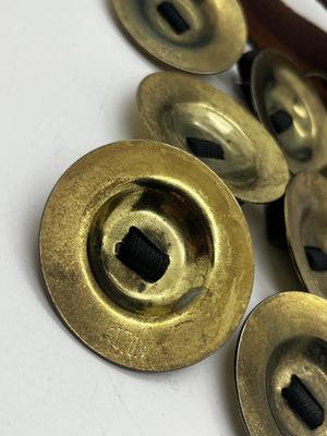 LOT 102: Finger Cymbals and Unique Leather Bracelet
