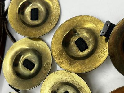 LOT 102: Finger Cymbals and Unique Leather Bracelet