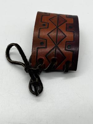 LOT 102: Finger Cymbals and Unique Leather Bracelet