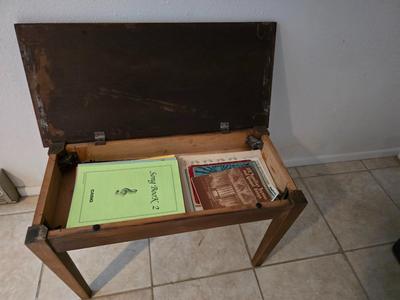 Piano Bench full of music books