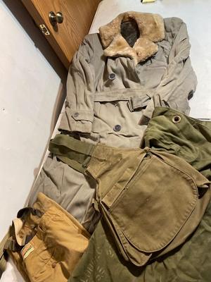 Vintage coat, army bags, and suspender pants