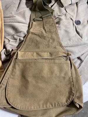 Vintage coat, army bags, and suspender pants
