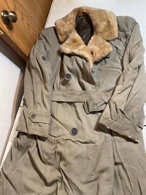 Vintage coat, army bags, and suspender pants